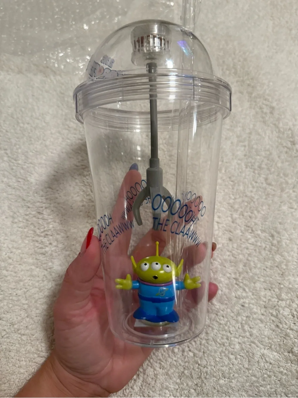 Disney Clear Claw Machine Cup with Green Alien and Blue Outfit